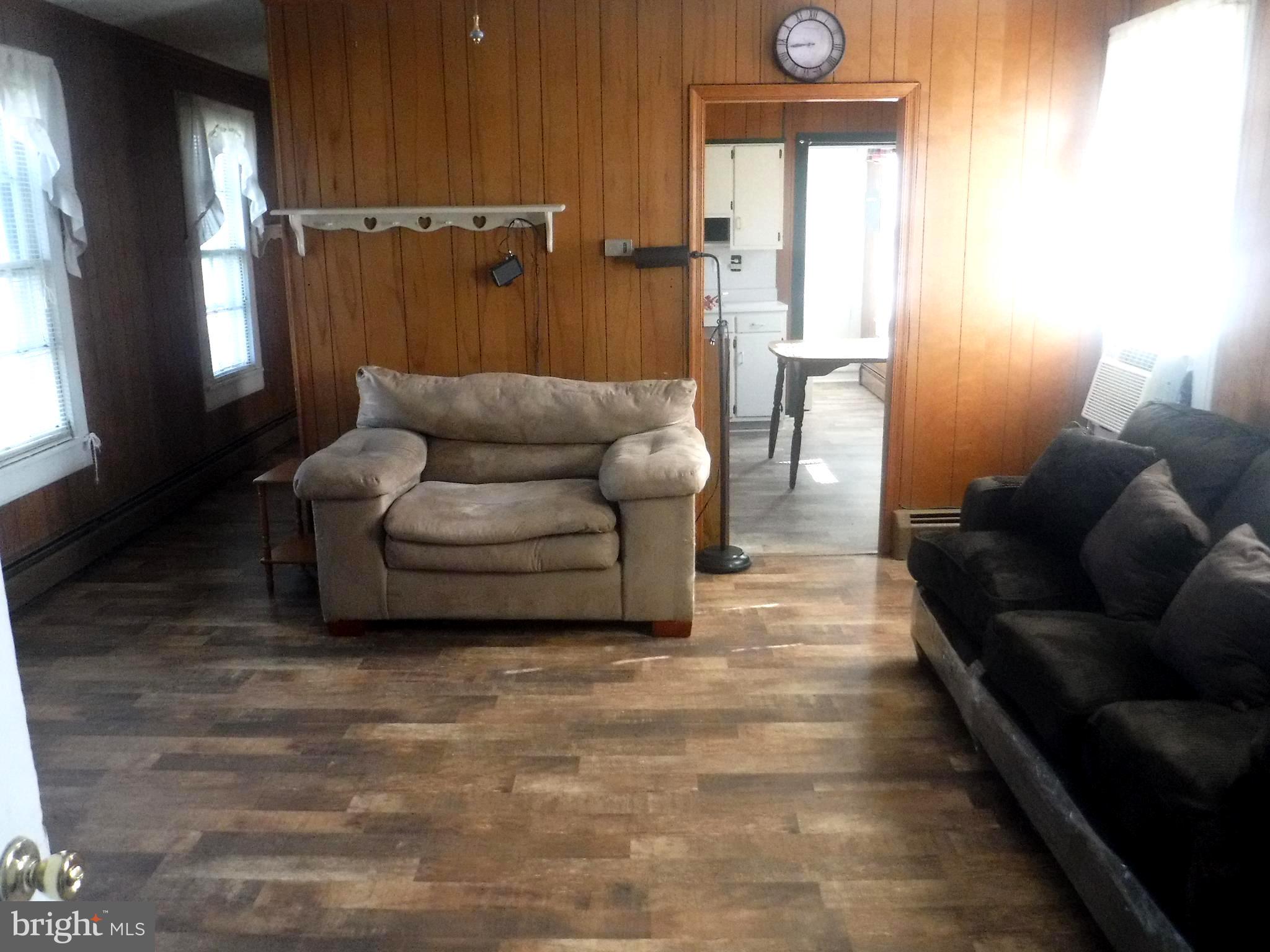 Apt #2-19 Apt, Unit 2 19 Felton, DE 19943 - Photo 5 of 10 a living room with furniture and a large window