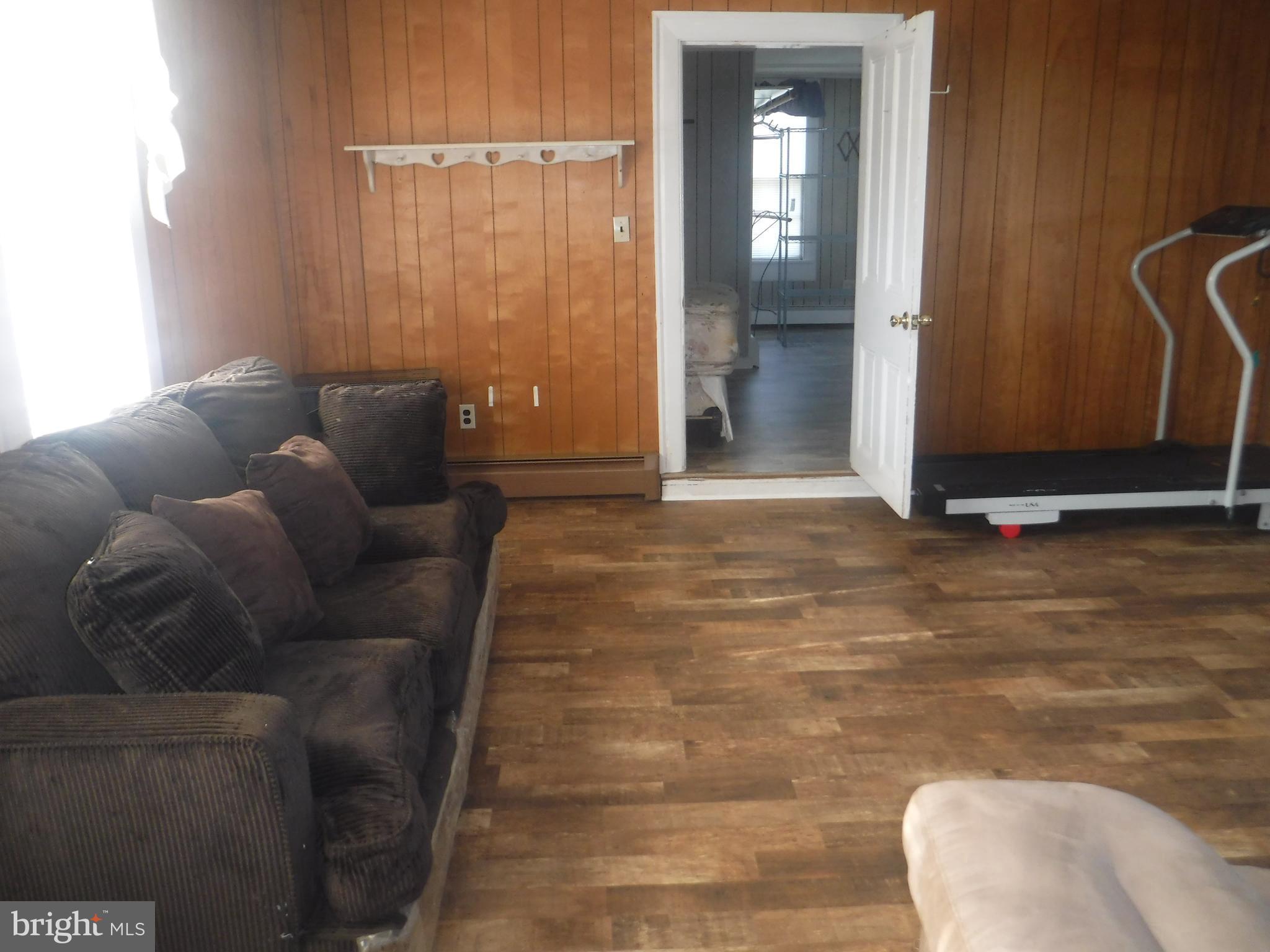 Apt #2-19 Apt, Unit 2 19 Felton, DE 19943 - Photo 7 of 10 a living room with furniture and a window