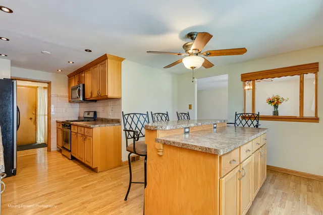 a very nice looking kitchen with a large window