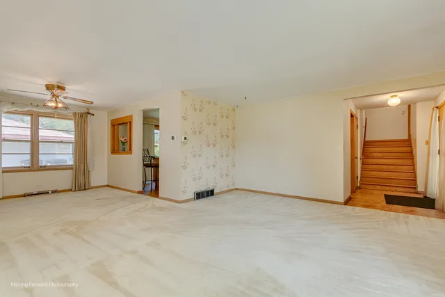 a view of an empty room with a window