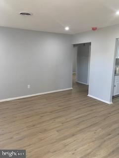 223 Kinsley Road Pemberton, NJ 08068 - Photo 4 of 12 a view of an empty room with wooden floor