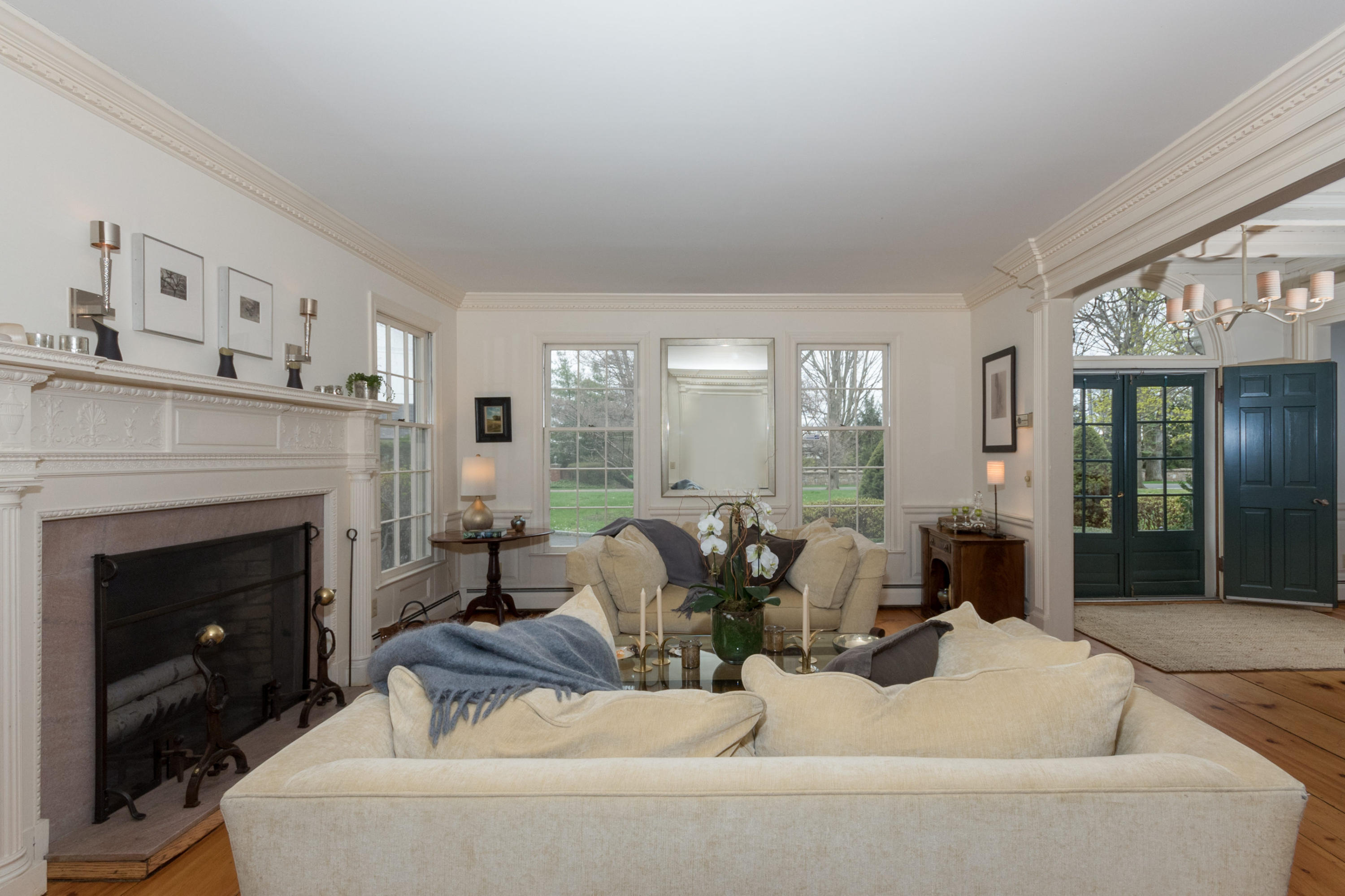 106 Long Neck Point Road Darien, CT 06820 - Photo 11 of 48 a living room with furniture and a fireplace