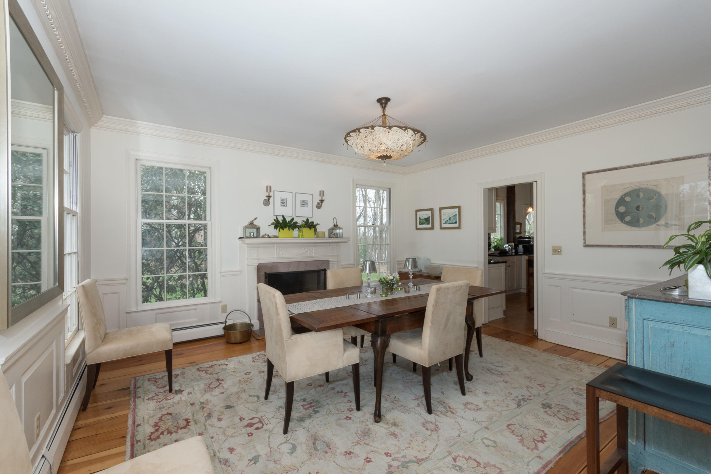 106 Long Neck Point Road Darien, CT 06820 - Photo 13 of 48 a view of a dining room with furniture a rug and wooden floor
