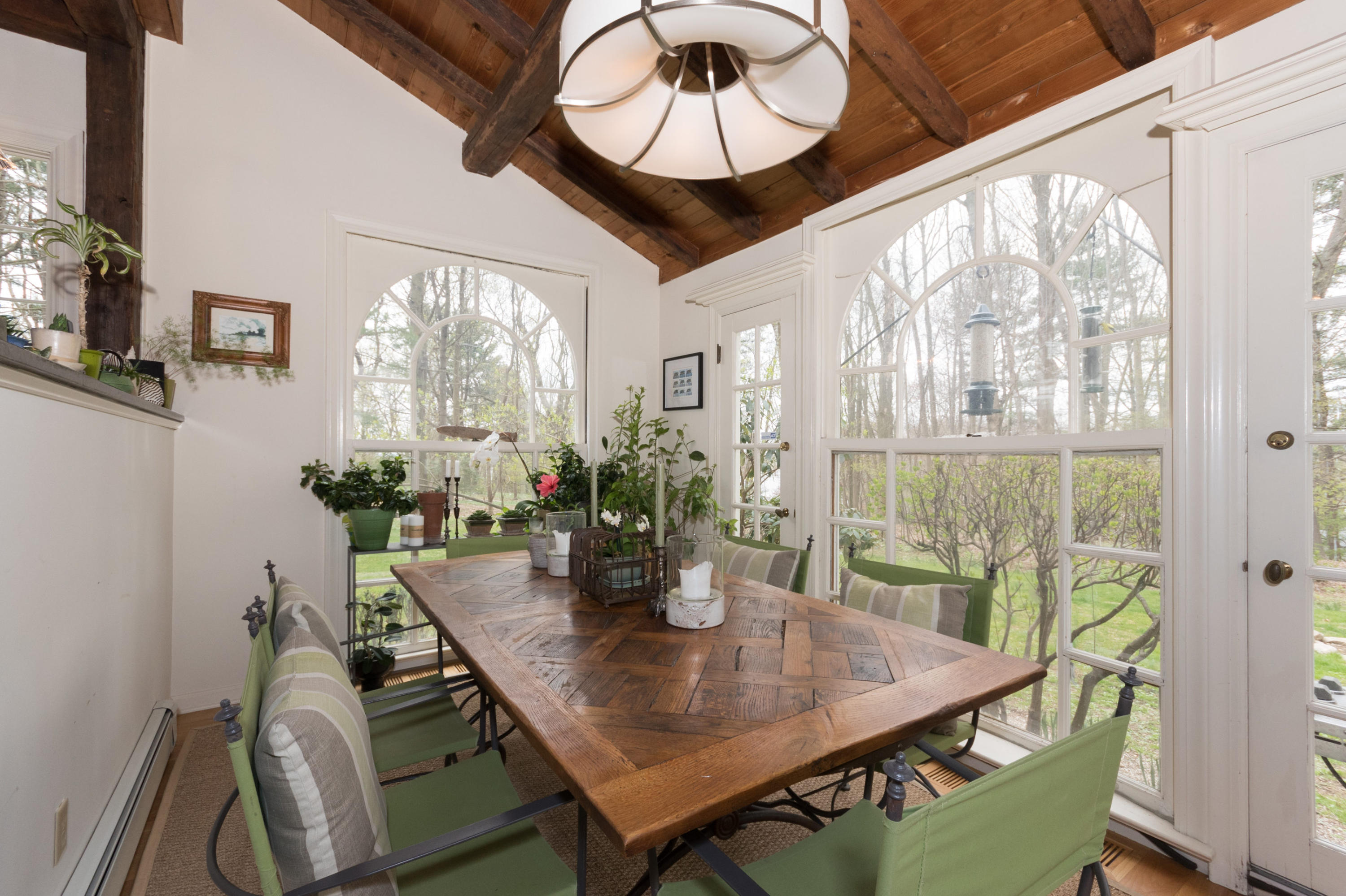 106 Long Neck Point Road Darien, CT 06820 - Photo 19 of 48 a view of a dining room with furniture window and wooden floor