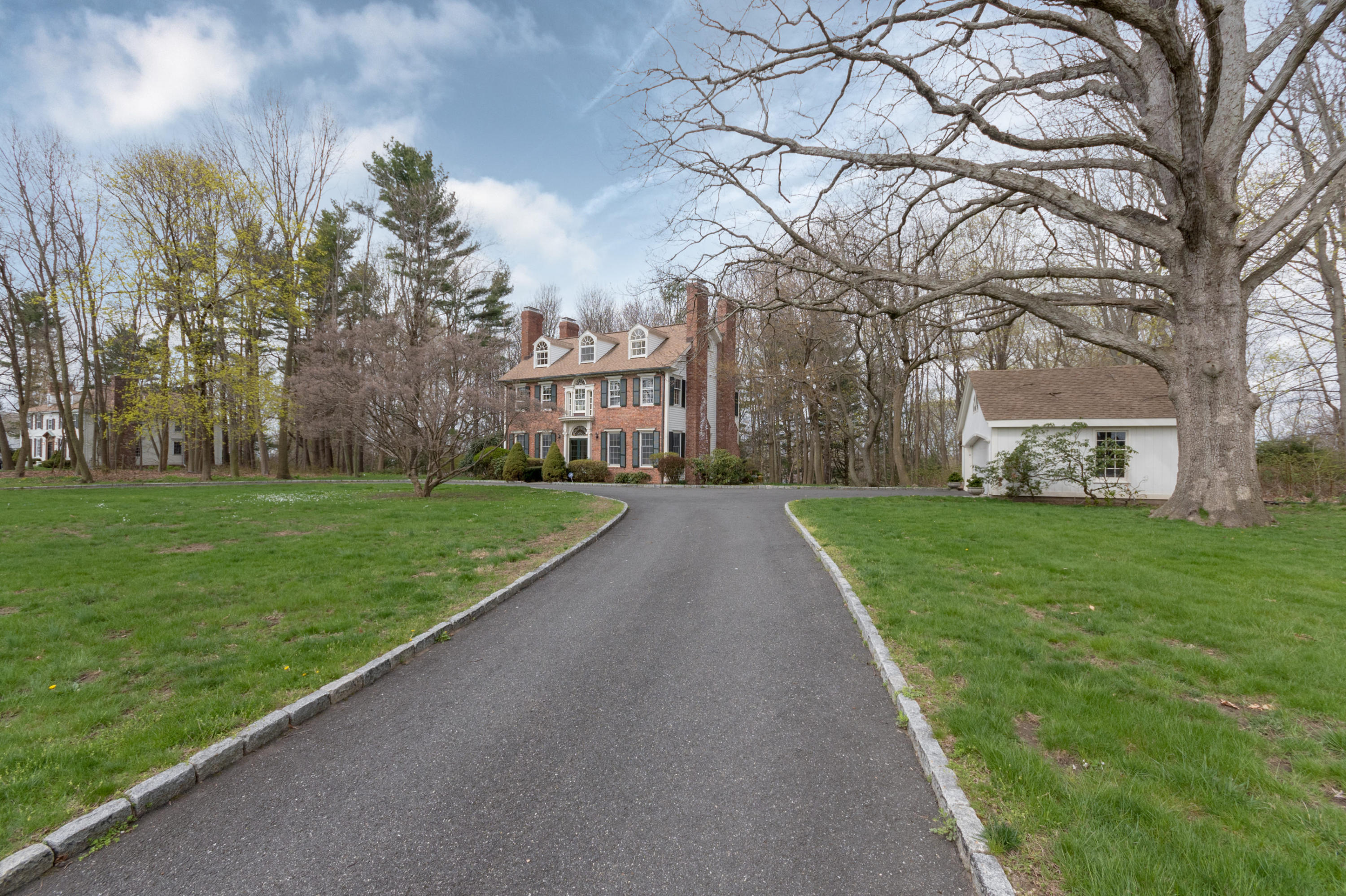 106 Long Neck Point Road Darien, CT 06820 - Photo 2 of 48 a view of a park with large trees