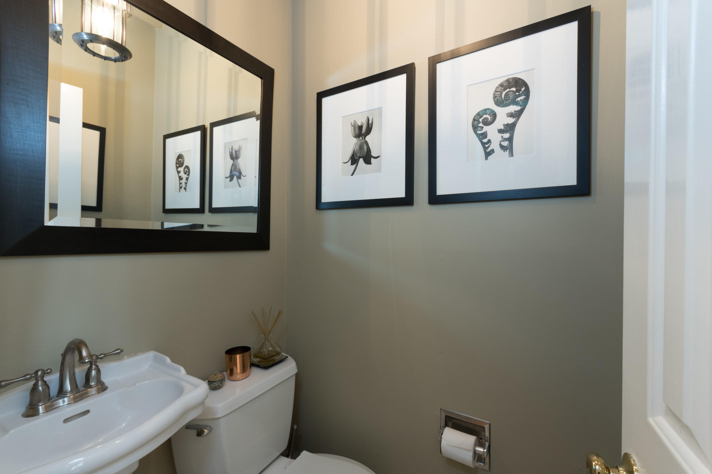 106 Long Neck Point Road Darien, CT 06820 - Photo 22 of 48 a bathroom with a sink and a mirror