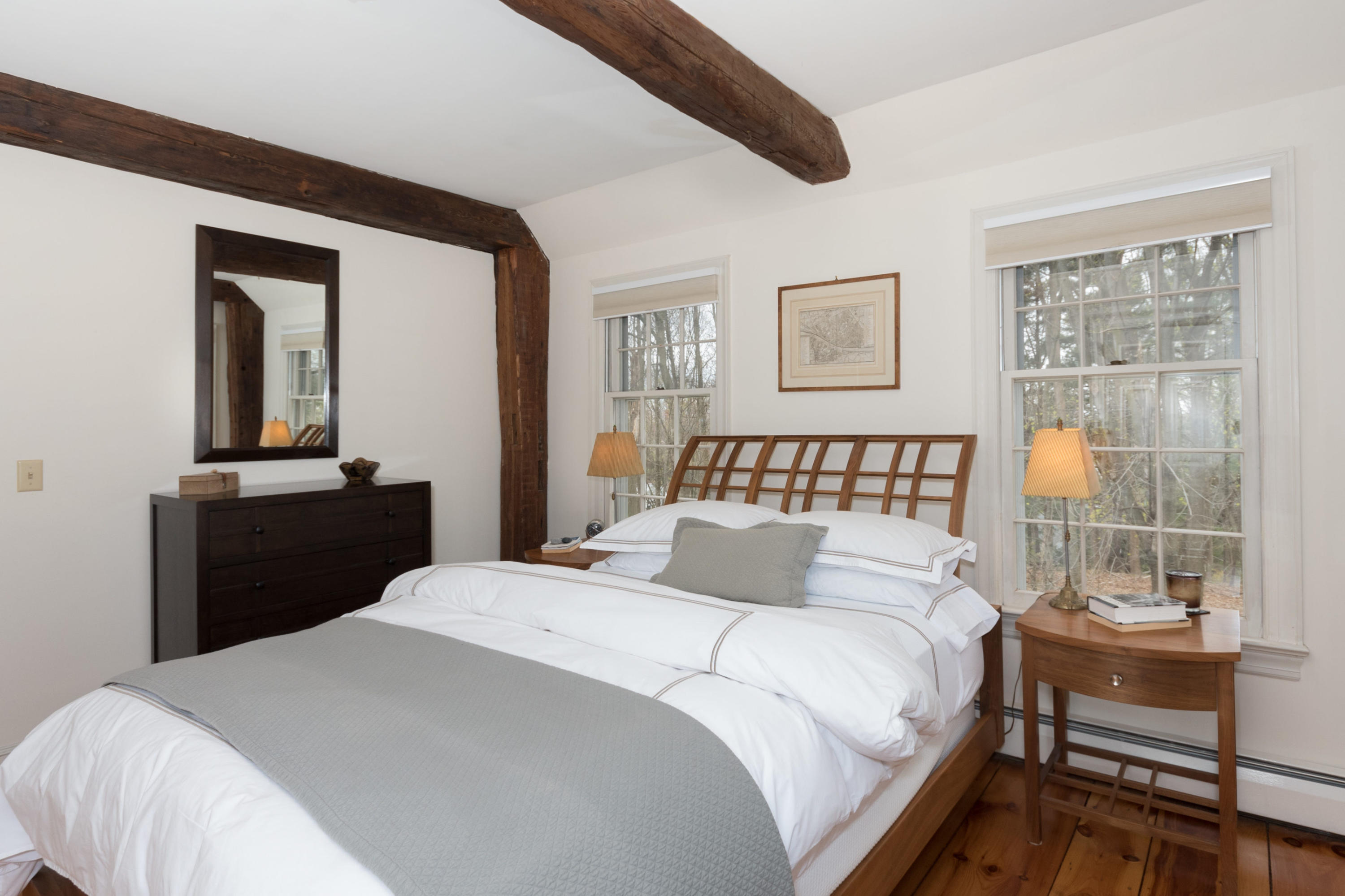 106 Long Neck Point Road Darien, CT 06820 - Photo 29 of 48 a bedroom with a bed and a table