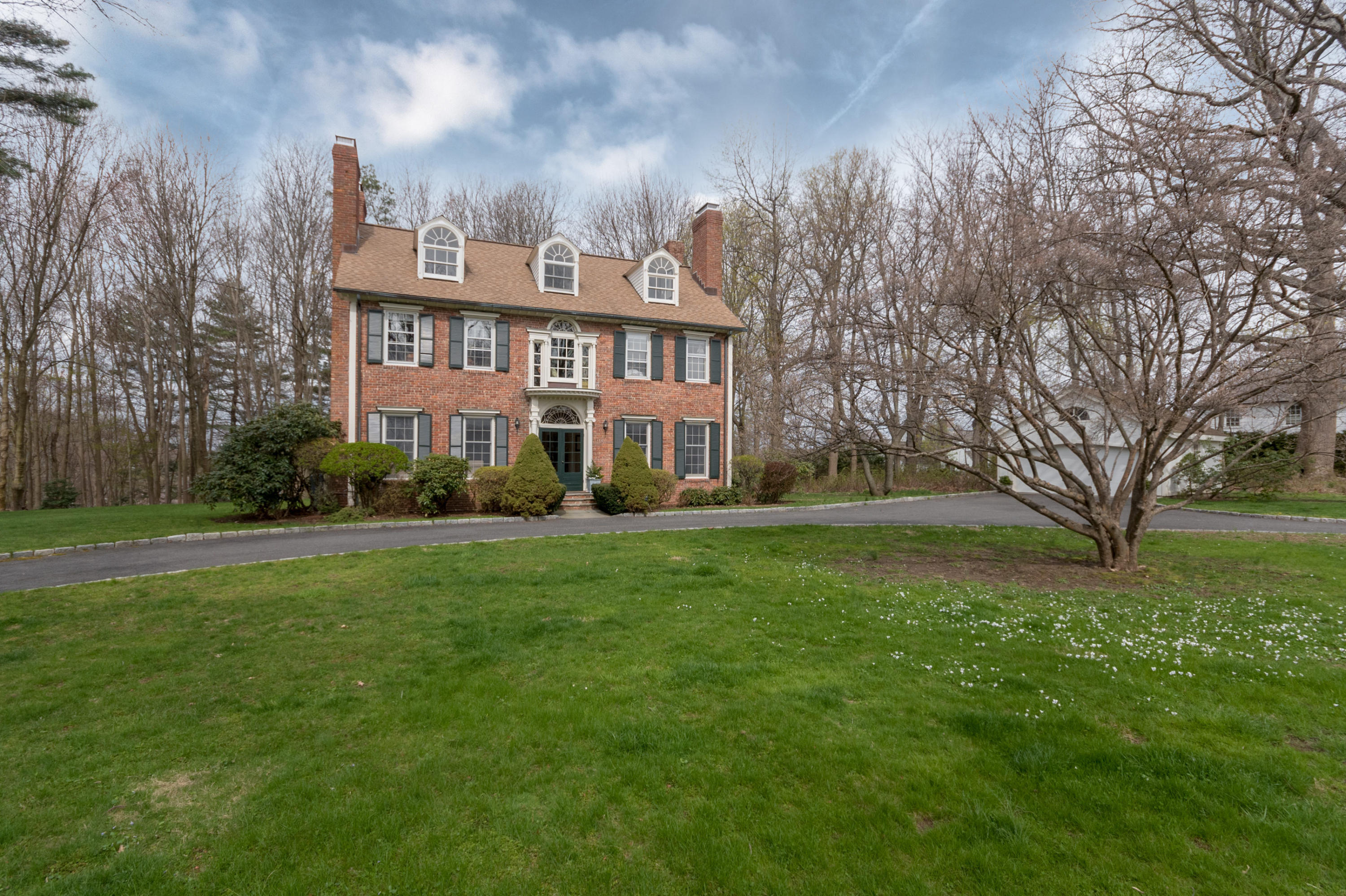106 Long Neck Point Road Darien, CT 06820 - Photo 3 of 48 a front view of a house with a yard