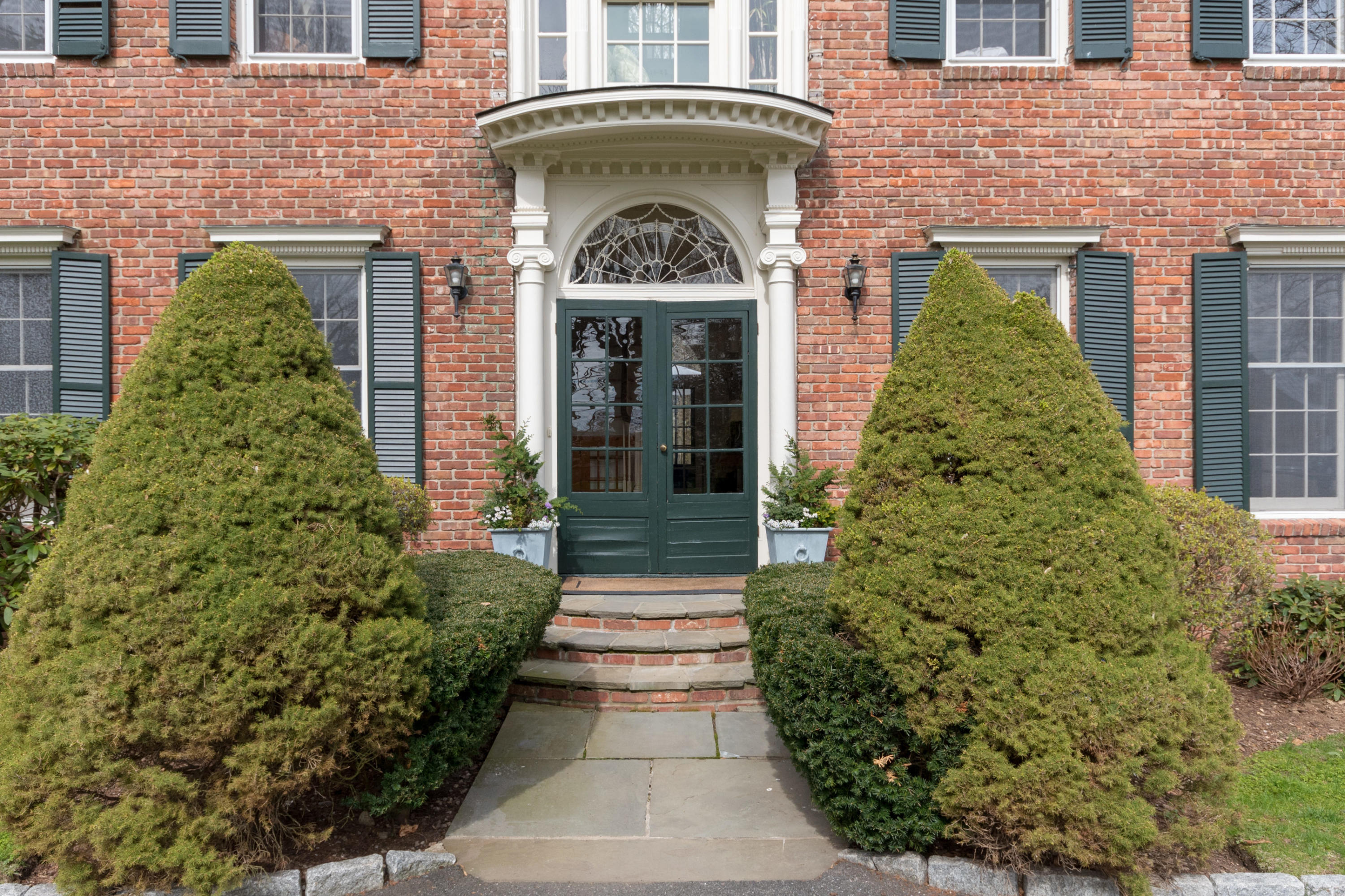 106 Long Neck Point Road Darien, CT 06820 - Photo 4 of 48 a front view of a house
