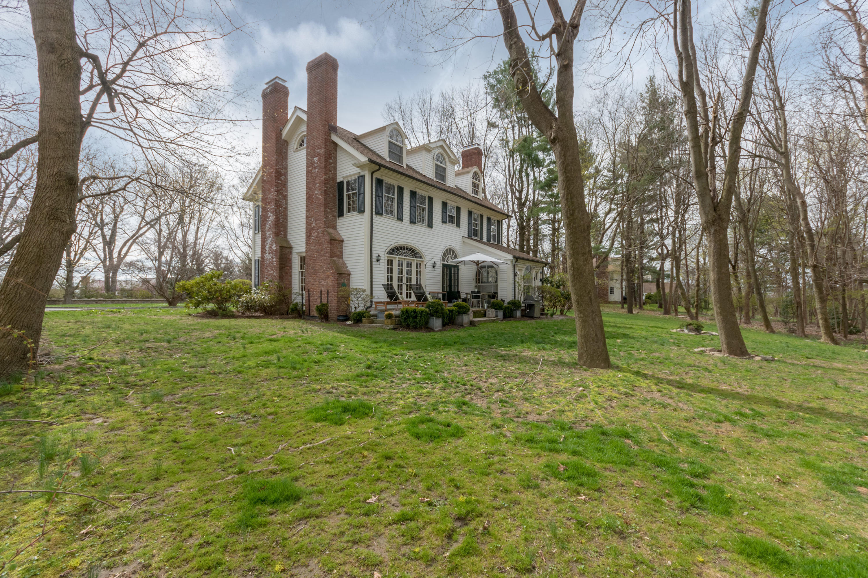 106 Long Neck Point Road Darien, CT 06820 - Photo 42 of 48 a view of a house with a yard