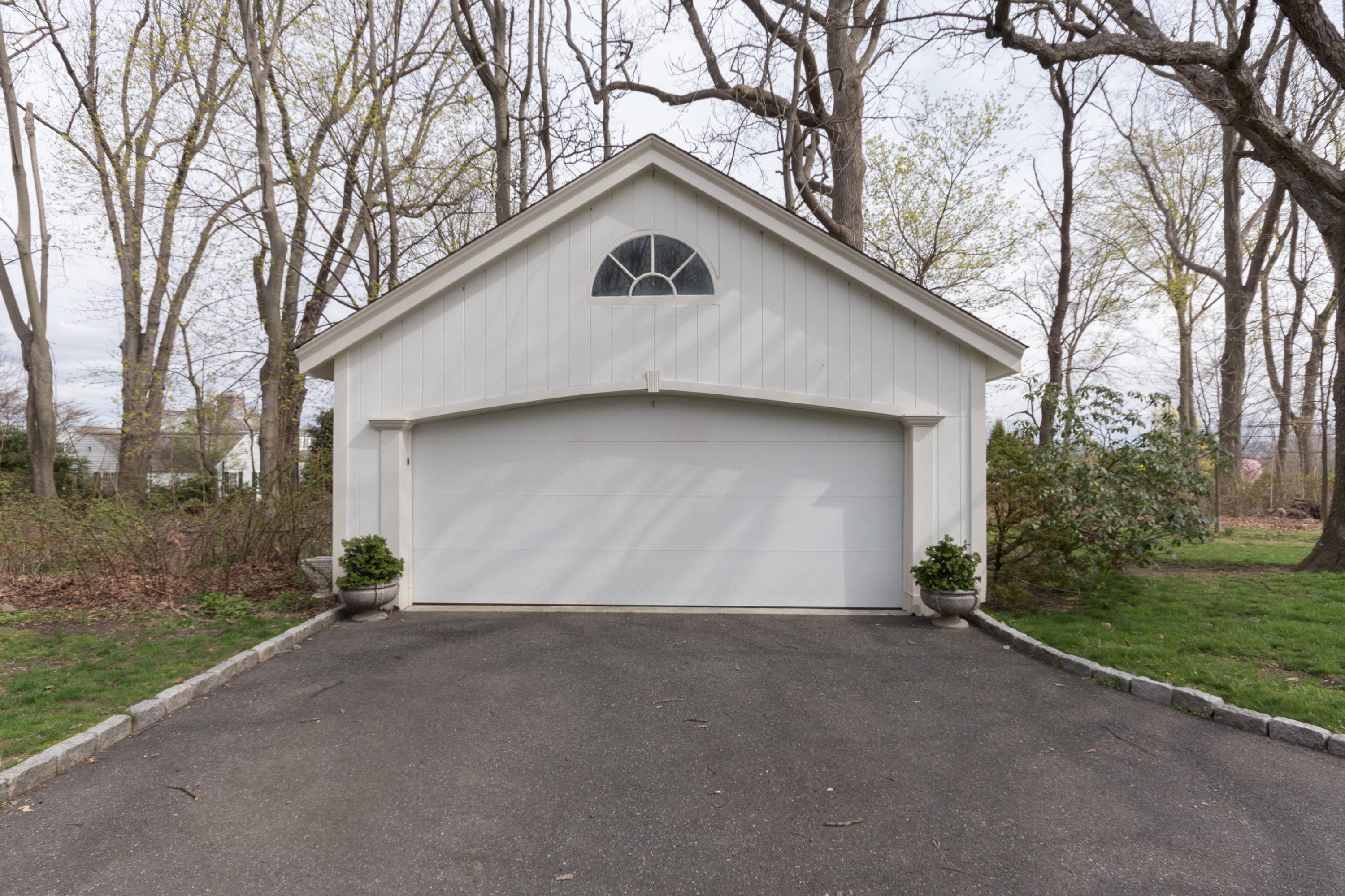 106 Long Neck Point Road Darien, CT 06820 - Photo 44 of 48 a view of a house with a yard and garage