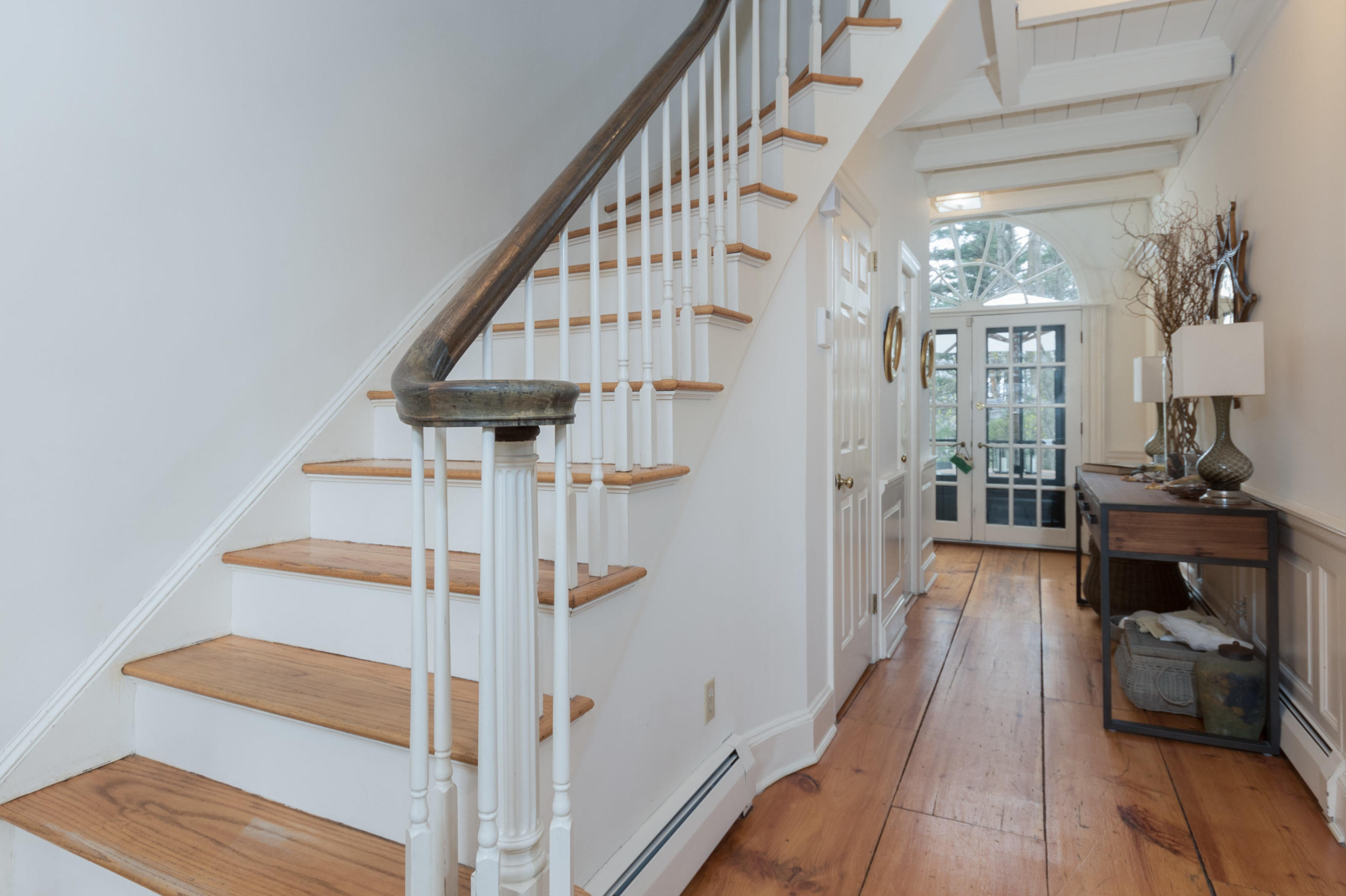 106 Long Neck Point Road Darien, CT 06820 - Photo 5 of 48 a view of entryway and hall with wooden floor