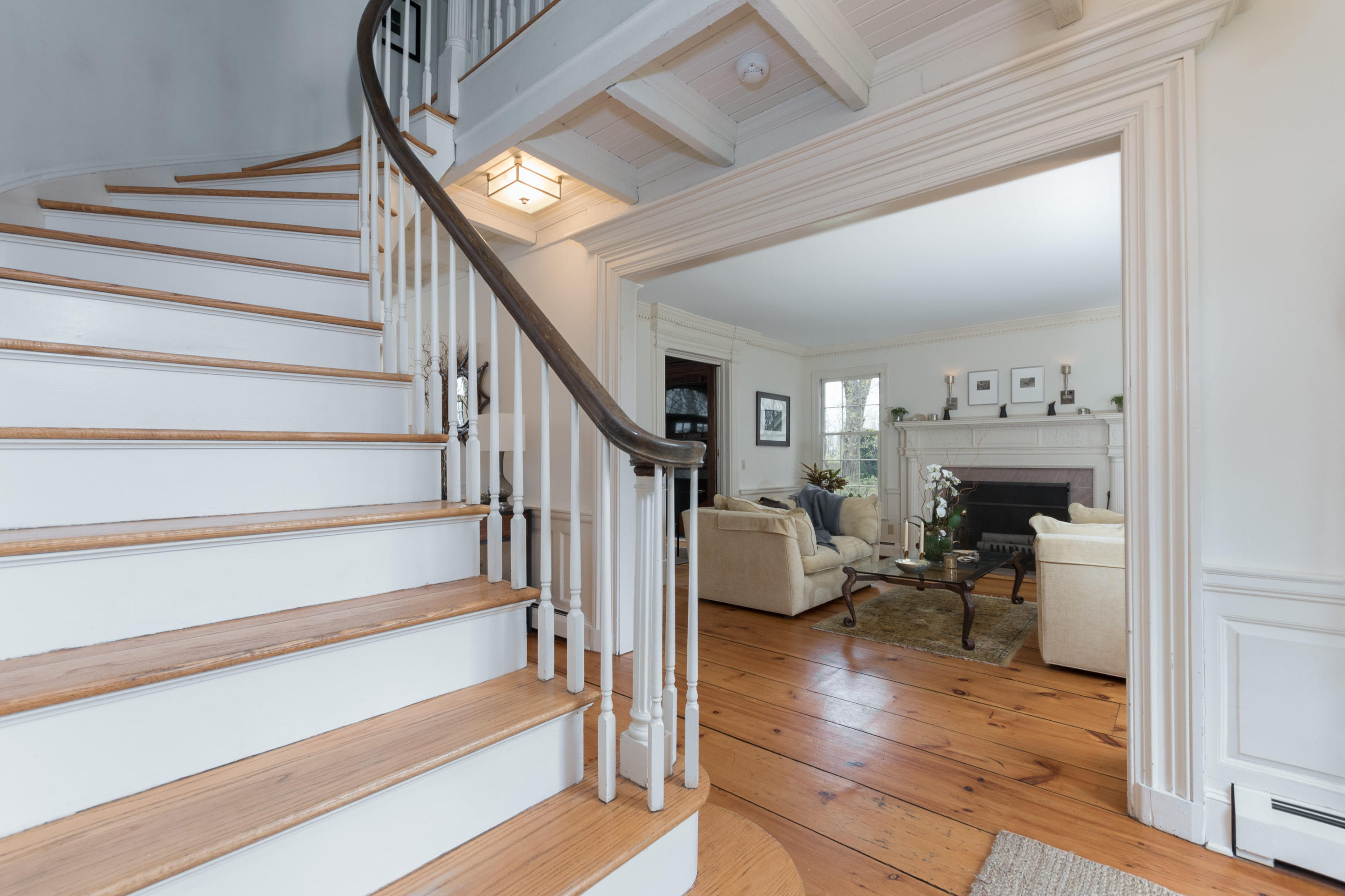 106 Long Neck Point Road Darien, CT 06820 - Photo 6 of 48 a view of entryway livingroom and hall with wooden floor