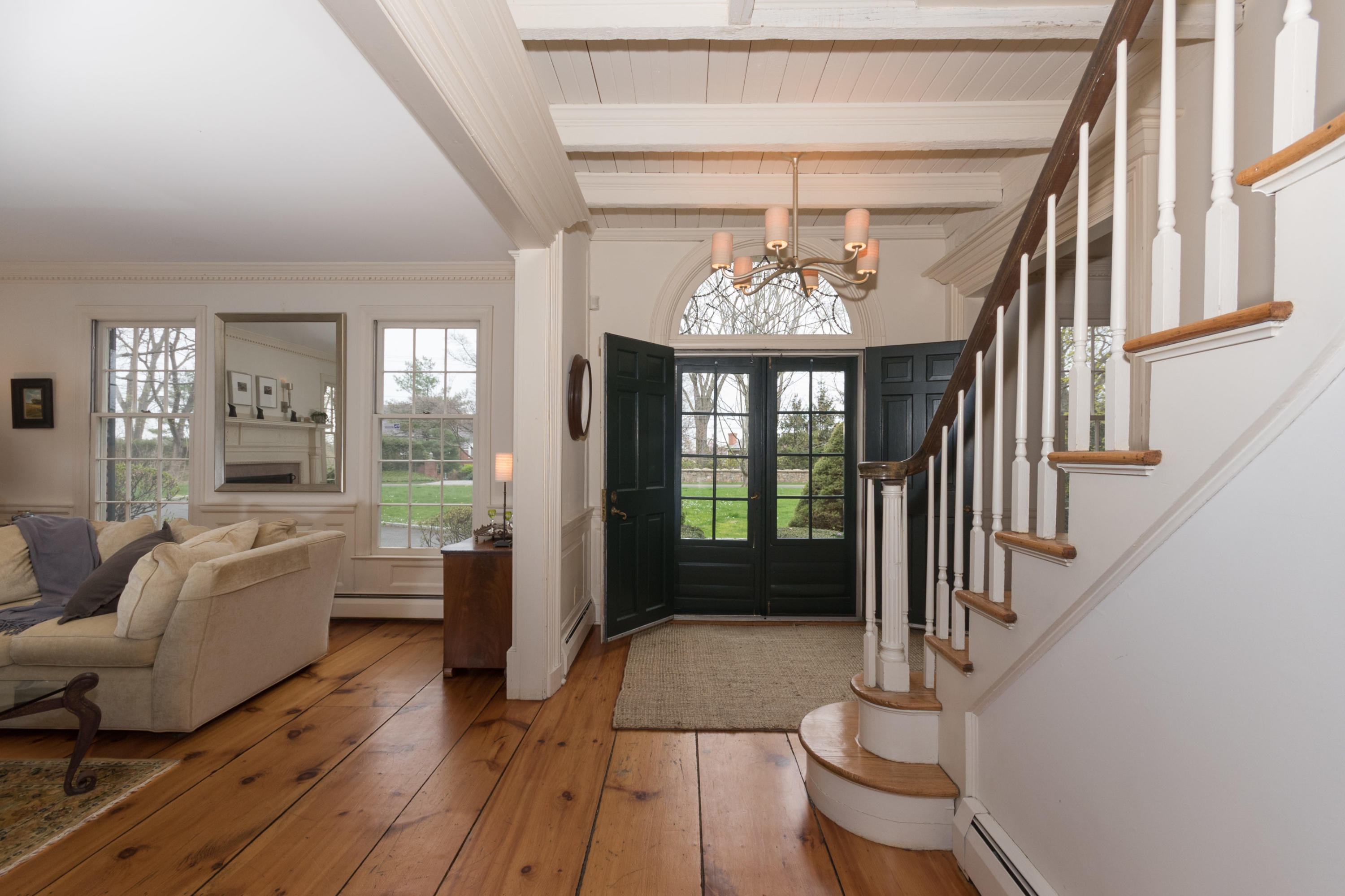 106 Long Neck Point Road Darien, CT 06820 - Photo 8 of 48 a living room with furniture and a chandelier
