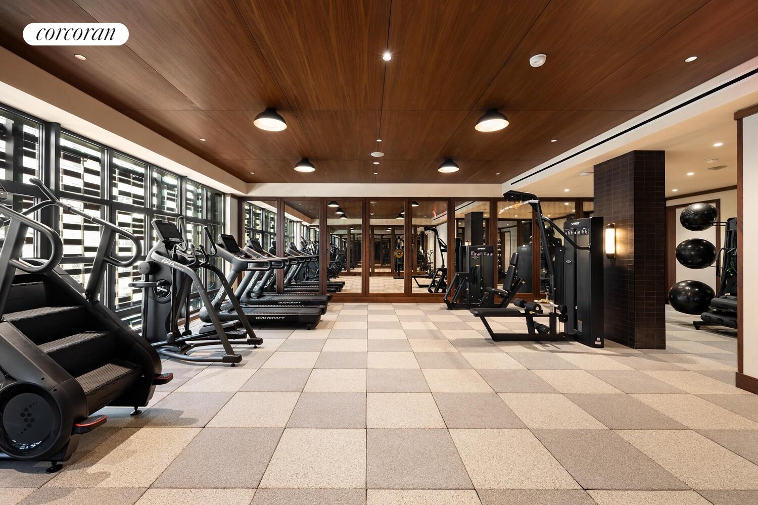 127 Kent Avenue, Unit 3F Brooklyn, NY 11249 - Photo 11 of 31 a view of a room with gym equipment