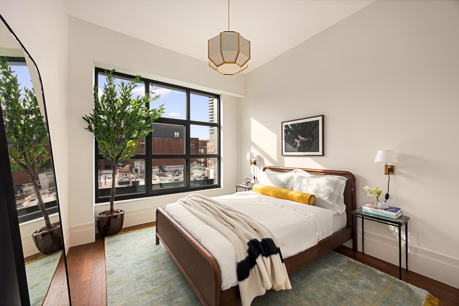 127 Kent Avenue, Unit 3F Brooklyn, NY 11249 - Photo 21 of 31 a bedroom with a bed and a large window