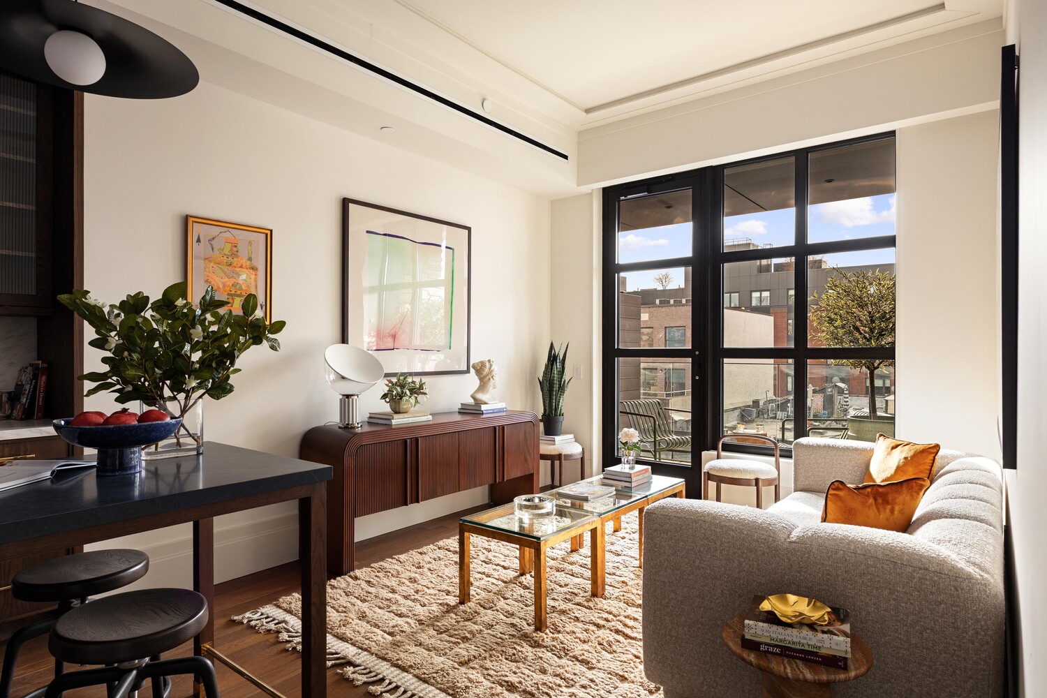 127 Kent Avenue, Unit 3F Brooklyn, NY 11249 - Photo 9 of 31 a living room with furniture and floor to ceiling windows