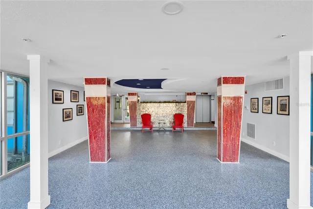 a view of a room with entryway wooden floor and closet