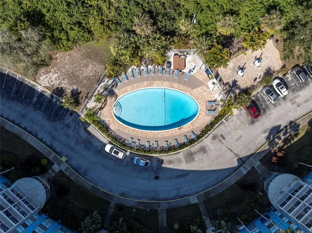 a view of a swimming pool with a yard