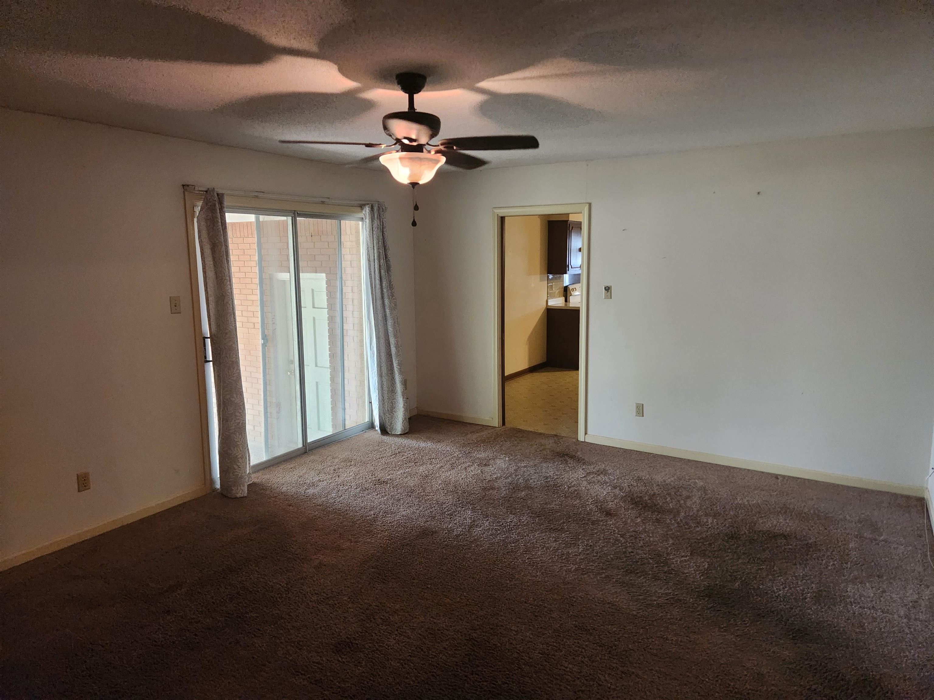 7505 Dexter Road Cordova, TN 38016 - Photo 12 of 27 Empty room featuring ceiling fan and carpet