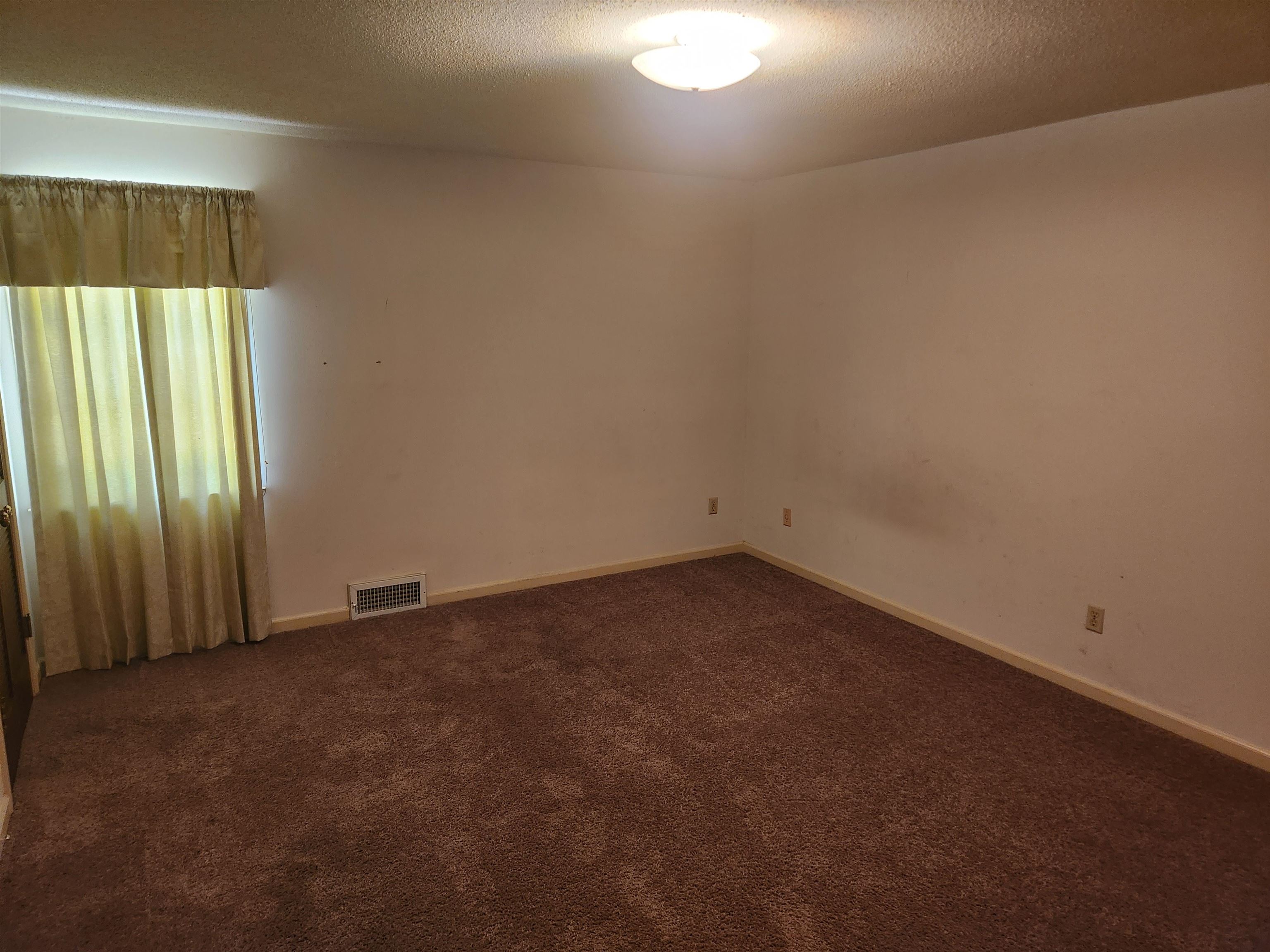 7505 Dexter Road Cordova, TN 38016 - Photo 15 of 27 Carpeted empty room with a textured ceiling