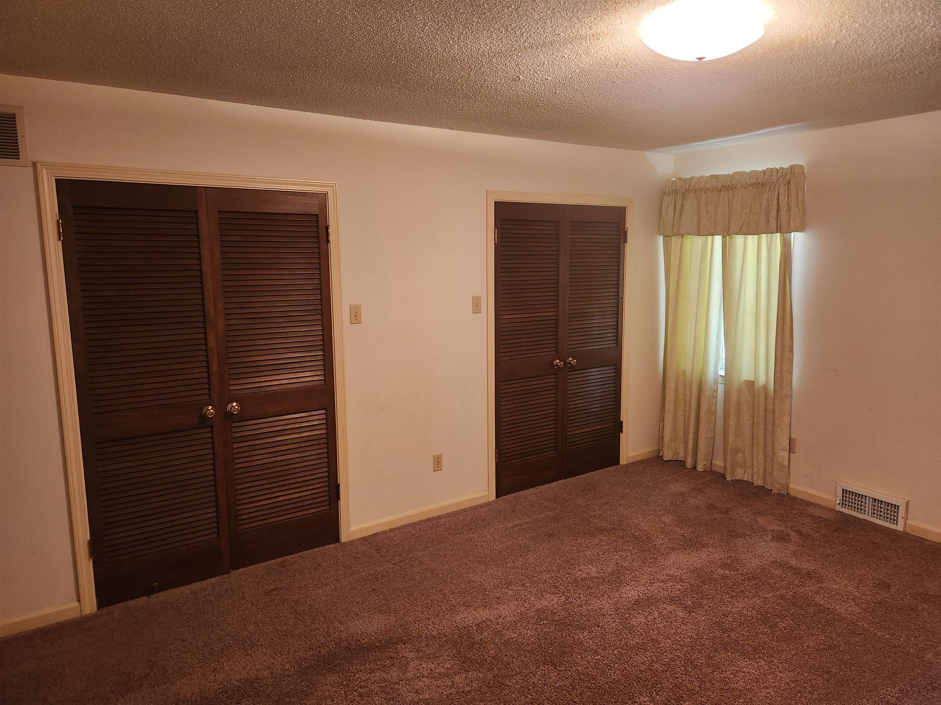 7505 Dexter Road Cordova, TN 38016 - Photo 16 of 27 Unfurnished bedroom with carpet and a textured ceiling