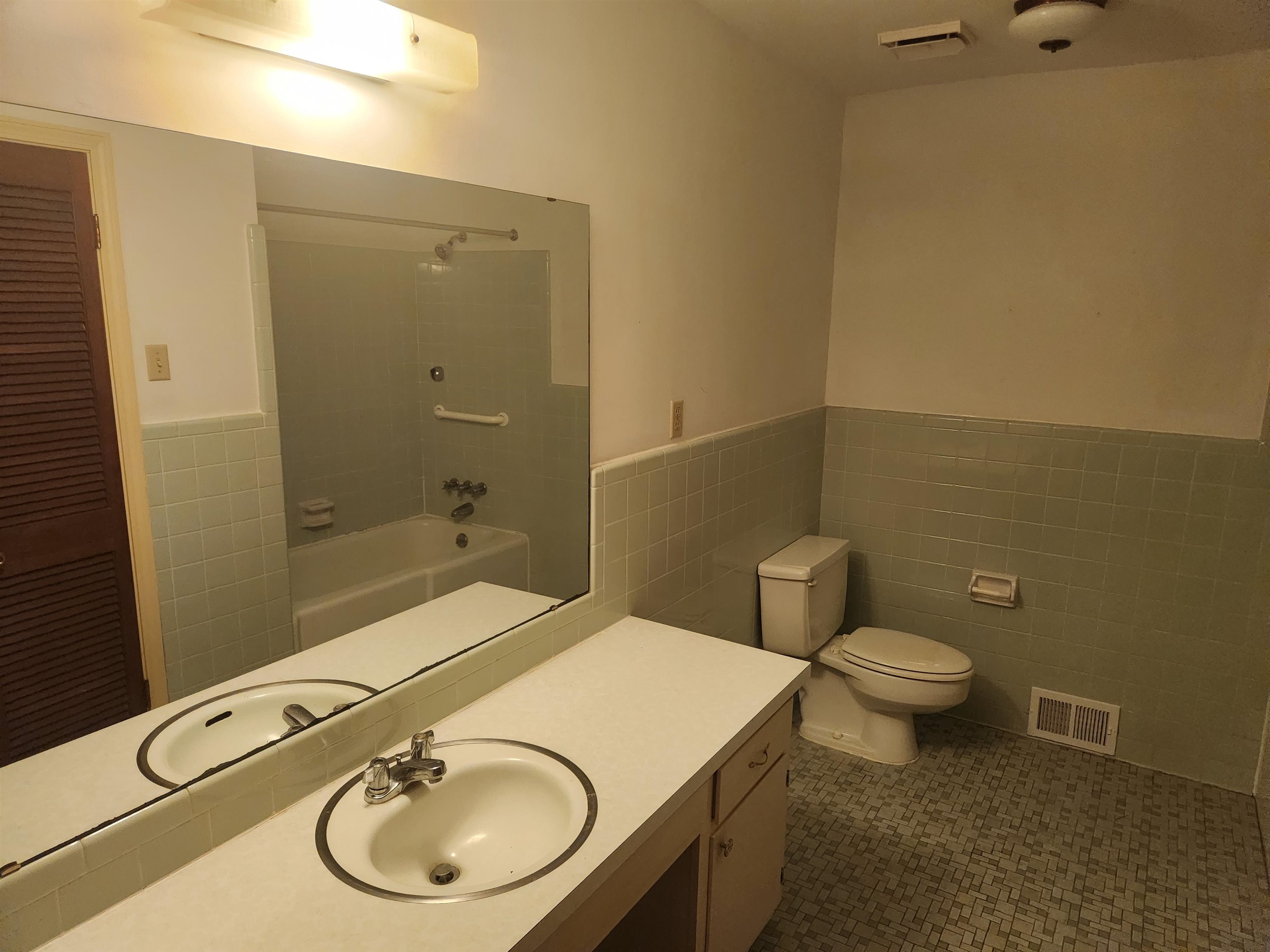 7505 Dexter Road Cordova, TN 38016 - Photo 17 of 27 Full bathroom with tile walls, vanity, tile patterned floors, and toilet