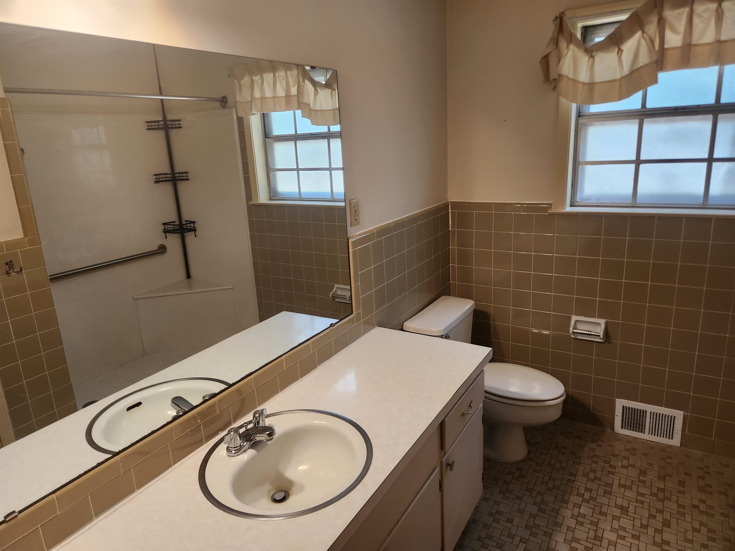 7505 Dexter Road Cordova, TN 38016 - Photo 20 of 27 Bathroom with vanity, tile patterned floors, a shower, tile walls, and toilet