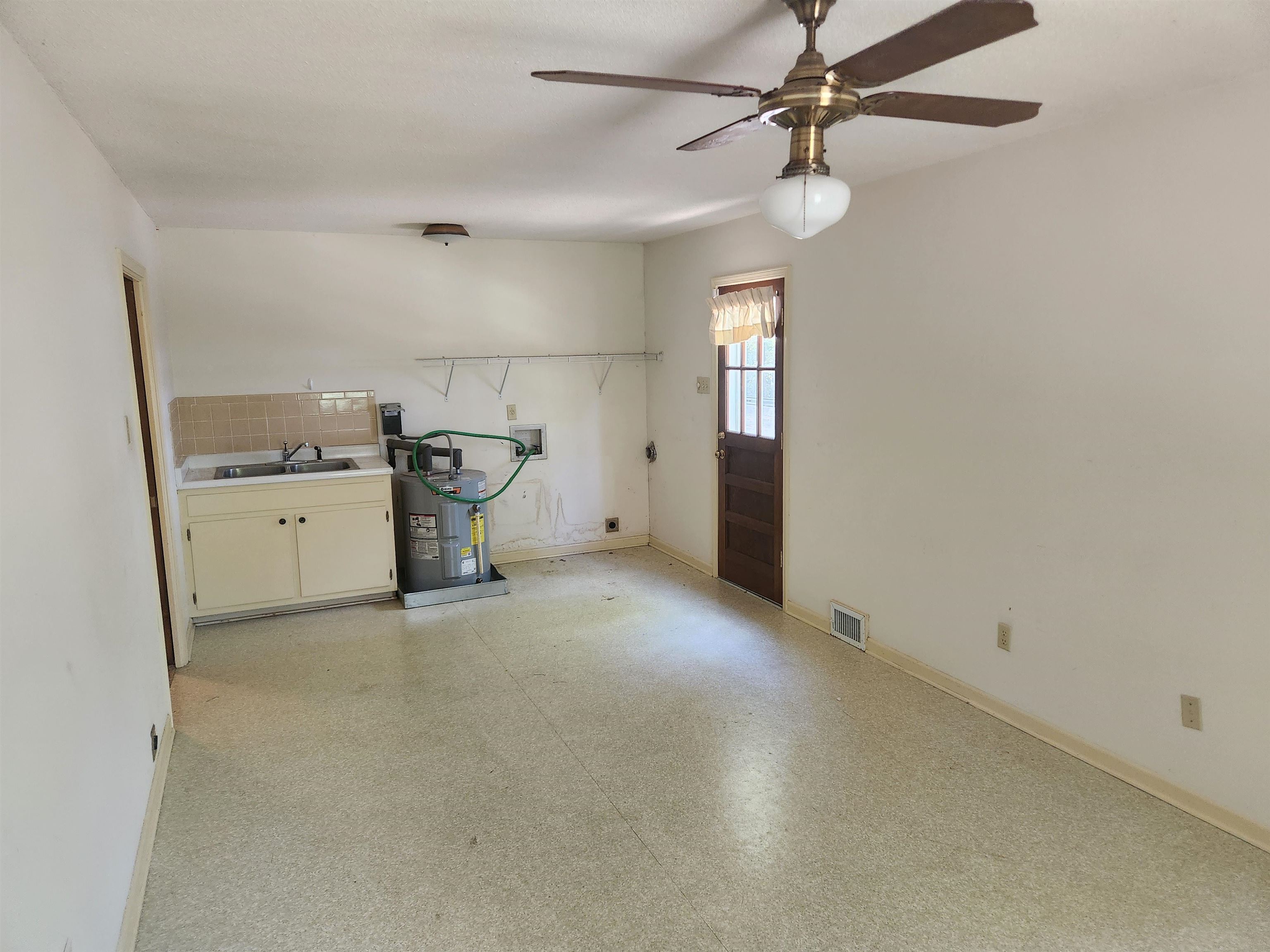 7505 Dexter Road Cordova, TN 38016 - Photo 22 of 27 Mud Room featuring ceiling fan, sink, and water heater