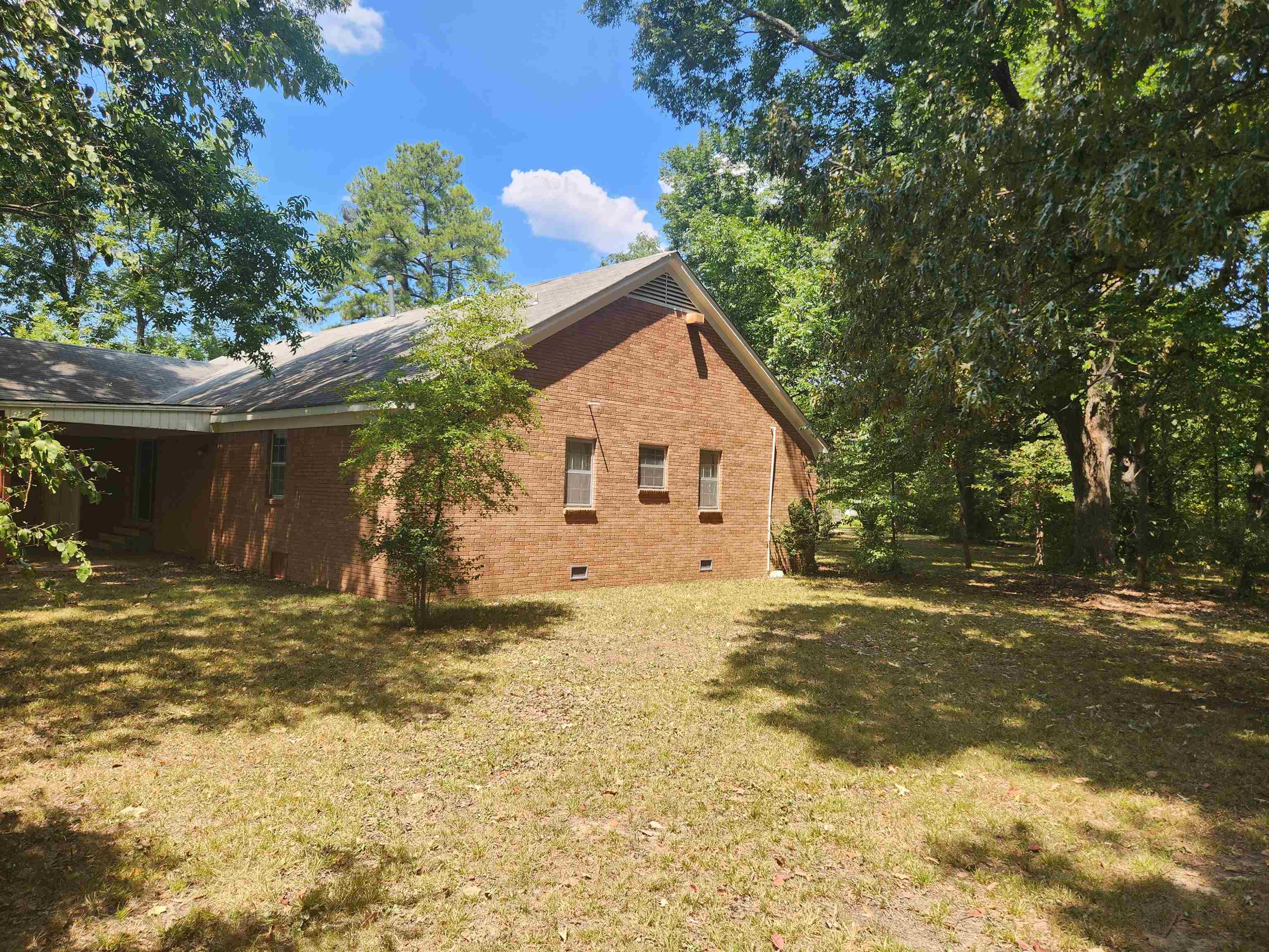 7505 Dexter Road Cordova, TN 38016 - Photo 25 of 27 View of side of property with a yard