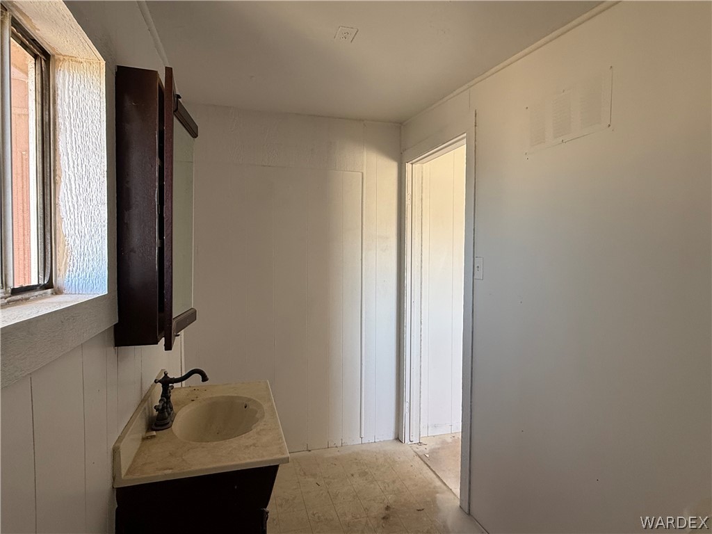 8051 7th Street Dolan Springs, AZ 86441 - Photo 14 of 65 a bathroom with a sink and a mirror