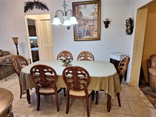 a view of a dining room and hall with furniture
