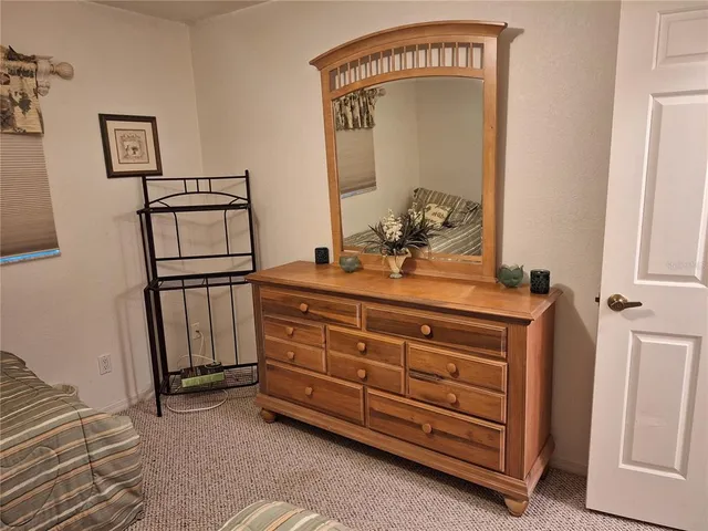 a view of a dresser in the room