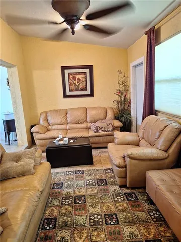 a living room with furniture and a rug
