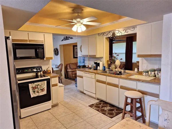 a kitchen with a sink appliances and cabinets