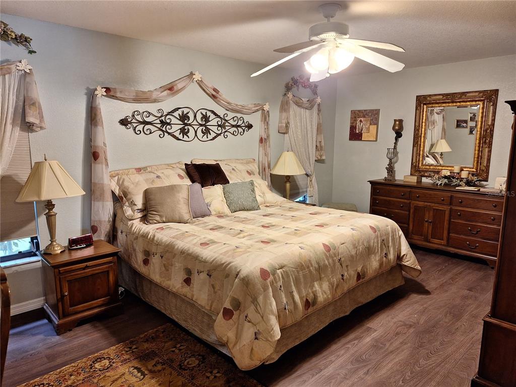 2223 Tinker Street Port Charlotte, FL 33948 - Photo 6 of 23 a bedroom with a bed and dresser with chair
