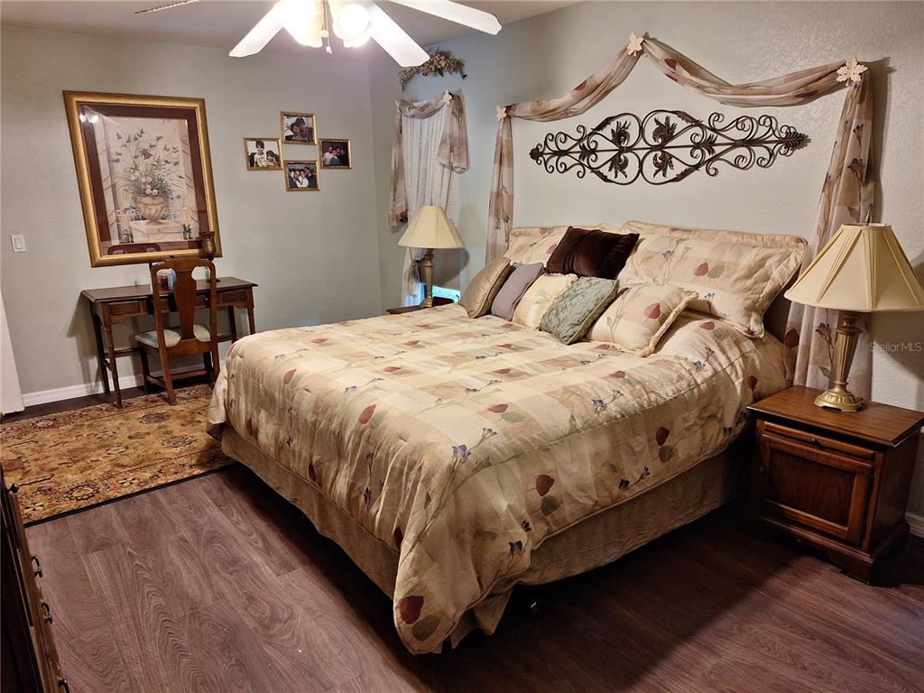 2223 Tinker Street Port Charlotte, FL 33948 - Photo 7 of 23 a large bed sitting in a bedroom next to a window