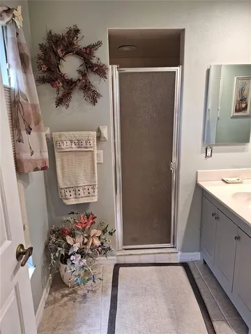 a view of a bathroom with a sink and mirror