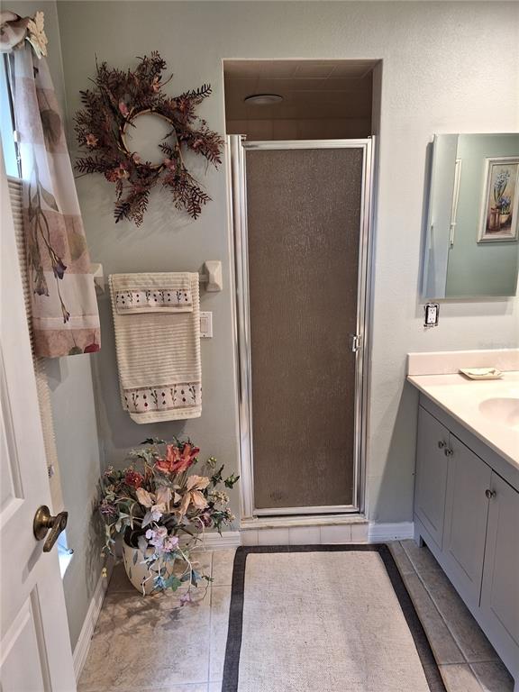 2223 Tinker Street Port Charlotte, FL 33948 - Photo 8 of 23 a view of a bathroom with a sink and mirror
