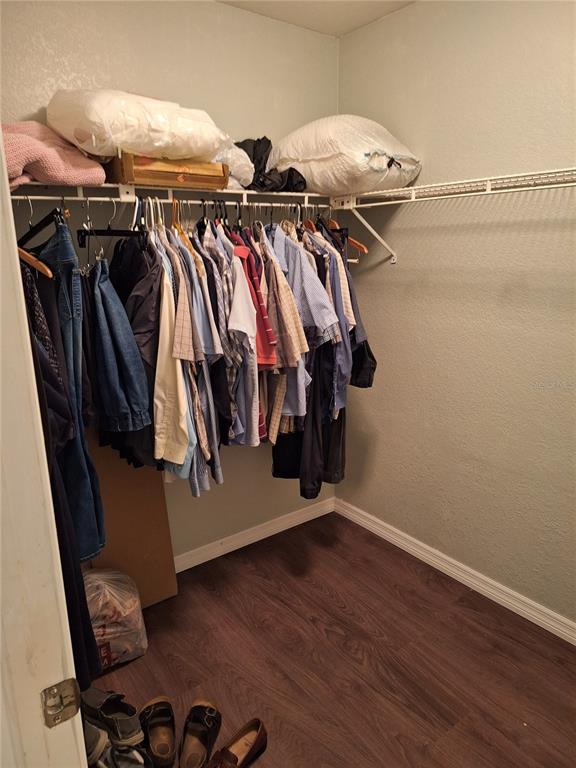 2223 Tinker Street Port Charlotte, FL 33948 - Photo 10 of 23 a view of walk in closet with clothes and shoes