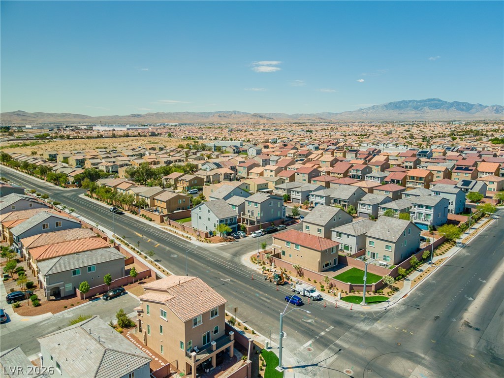 5510 Ripple Ridge Avenue Las Vegas, NV 89139 - Photo 10 of 45 This panoramic view showcases a vibrant community nestled among expansive desert landscapes.