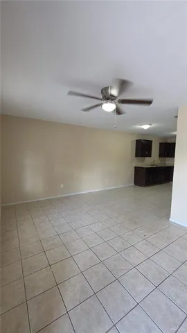 a kitchen with a refrigerator and a sink