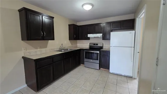 a view of kitchen with stainless steel appliances cabinets and a counter top space