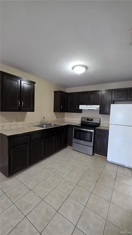 an empty room with closet and windows