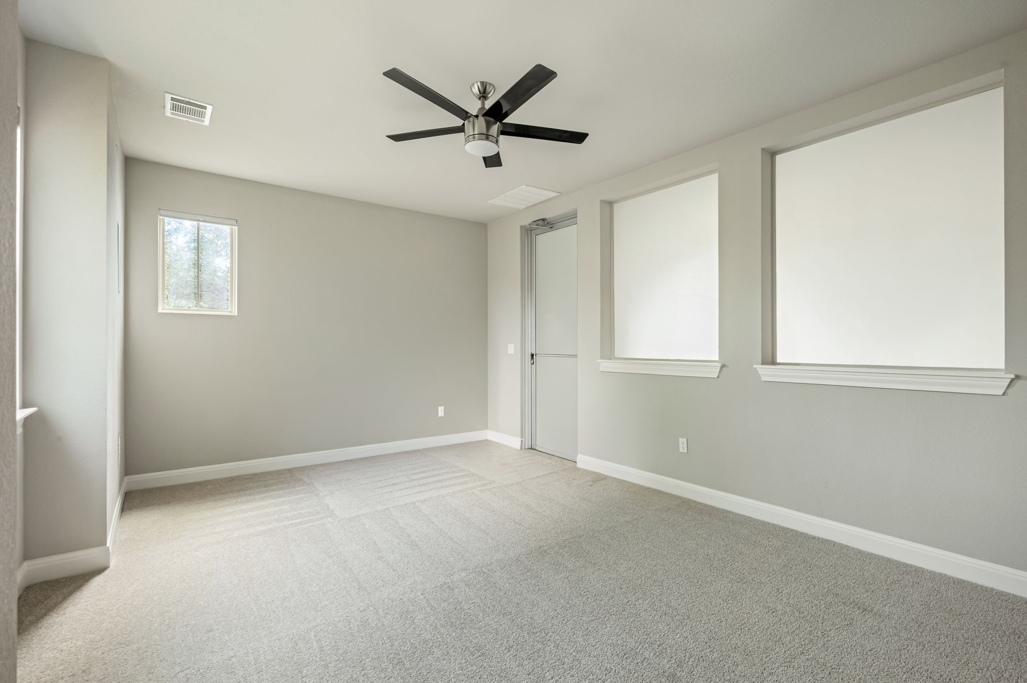 2516 Hopsack Mills Road Austin, TX 78748 - Photo 27 of 39 Spacious room featuring light gray carpet flooring and neutral wall tones