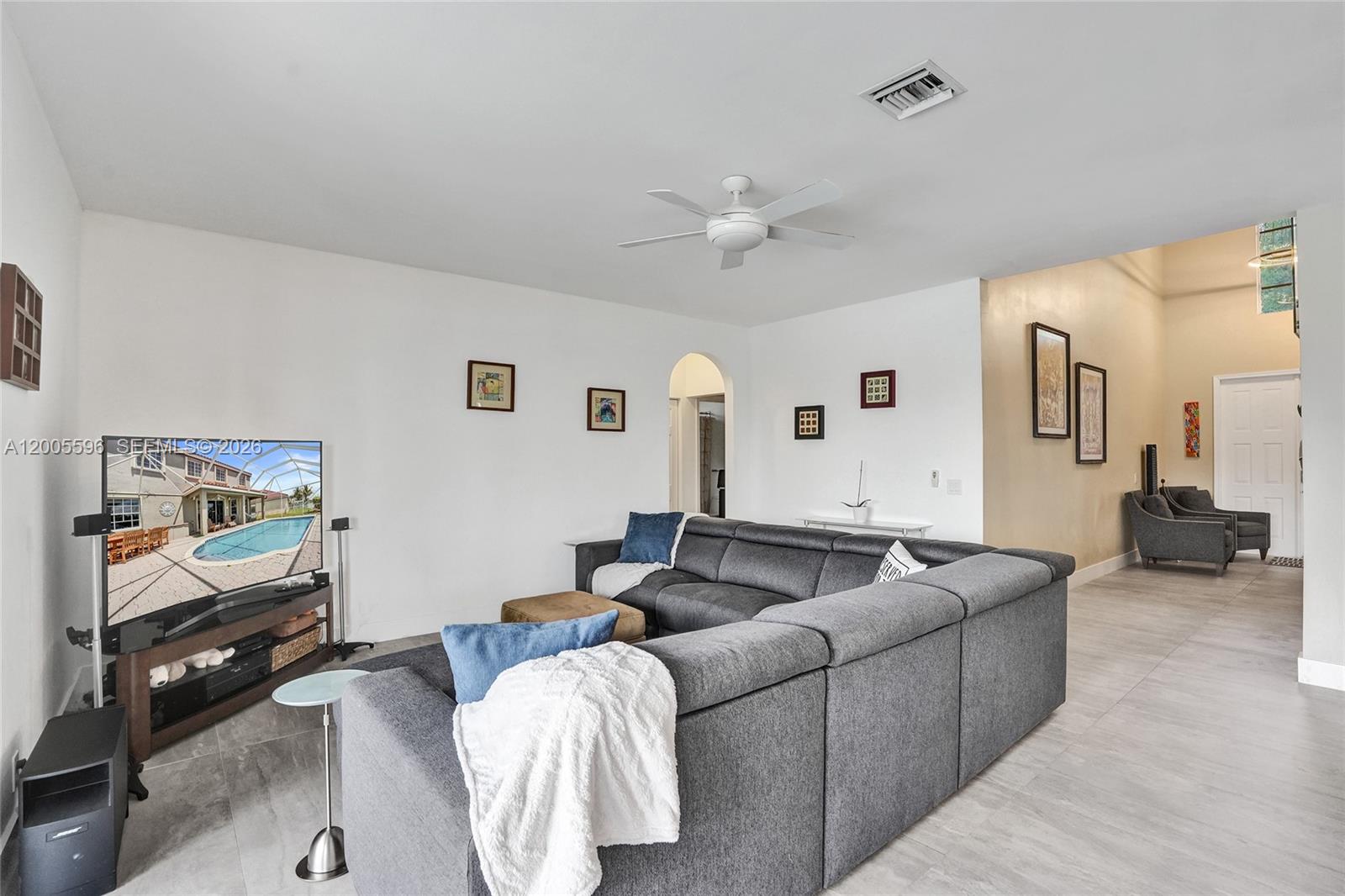 4281 Laurel Ridge Circle Weston, FL 33331 - Photo 33 of 80 a living room with furniture and a flat screen tv