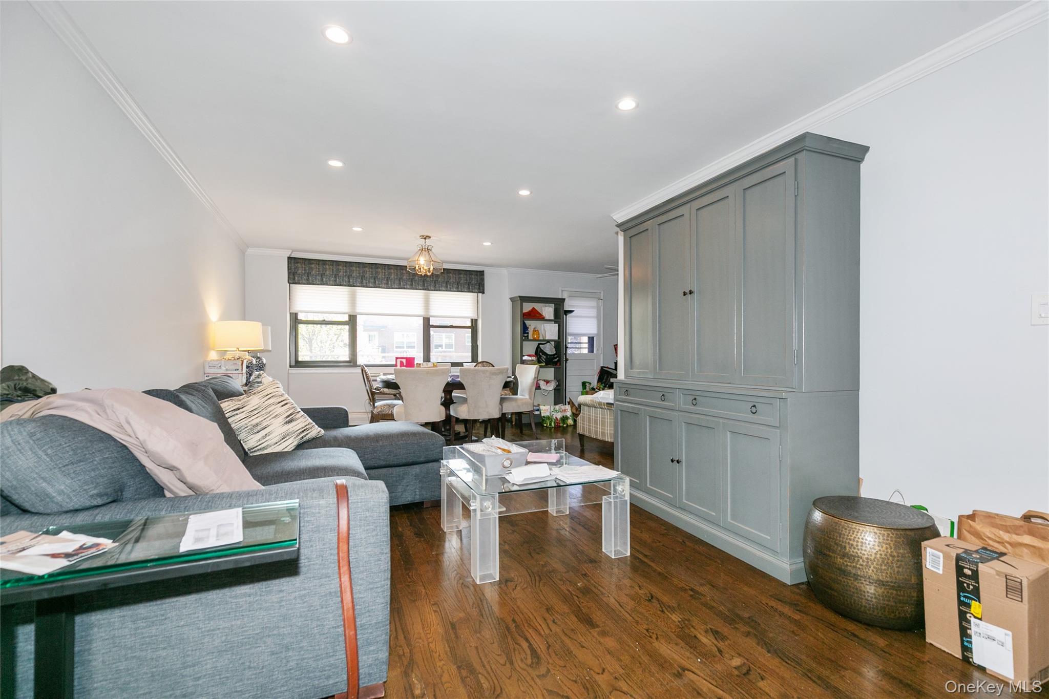 40 Stoner Avenue, Unit 2F Great Neck, NY 11021 - Photo 10 of 15 a living room with furniture and a wooden floor