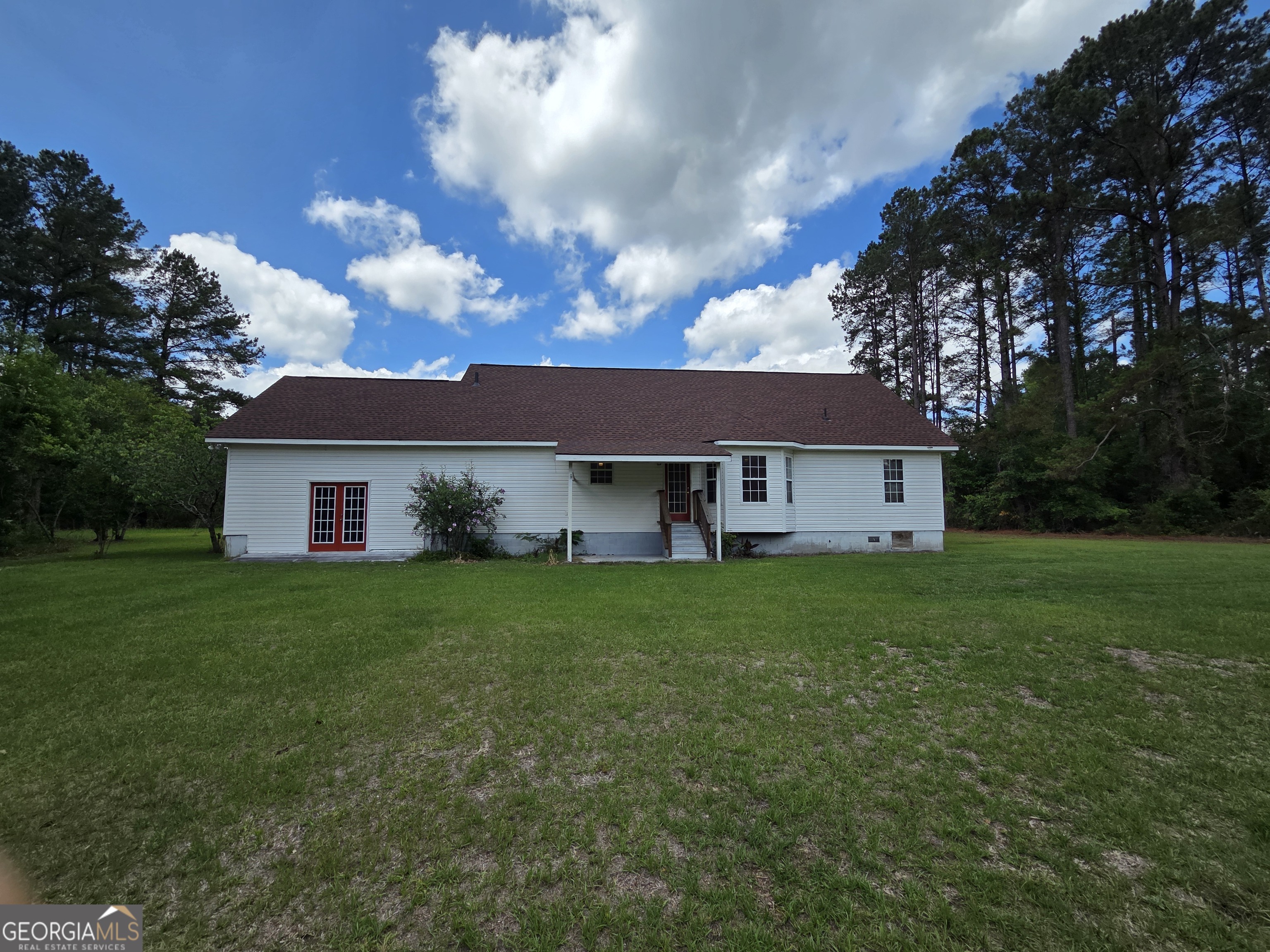 9546 Union Road Metter, GA 30439 - Photo 43 of 45 a view of a yard in front of a house with a large tree