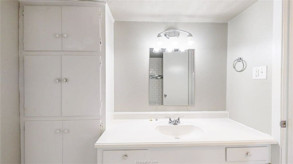 3800 East 29th Street, Unit 18 Bryan, TX 77802 - Photo 3 of 22 a bathroom with a sink and a mirror