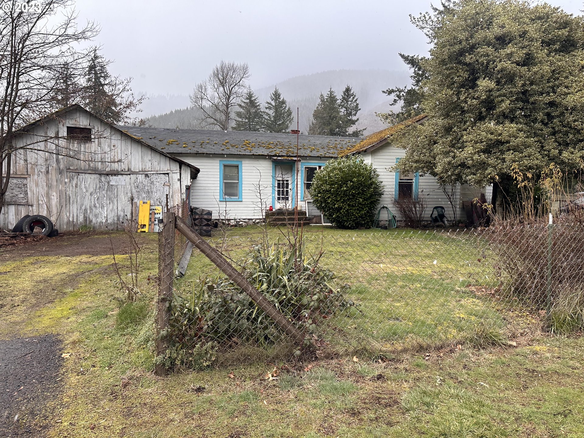 37681 Row River Road Dorena, OR 97434 - Photo 1 of 16 a front view of a house with a yard